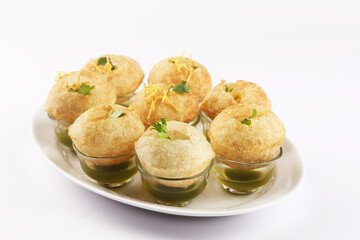 Panipuri or Golgappa is a popular street snack from India. It's a round, hollow puri filled with a mixture of flavoured water and other chat items