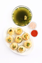 Panipuri or Golgappa is a popular street snack from India. It's a round, hollow puri filled with a mixture of flavoured water and other chat items © SMD IMAGES