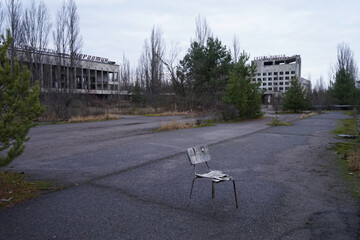 Abandoned chair in Pripyat, abandoned city with radioactive contamination after nuclear disaster in Chernobyl, Ukraine