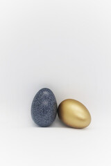 Two painted Easter eggs on a white background