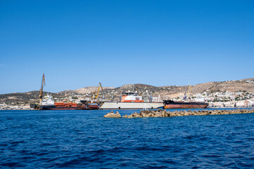 Fototapeta na wymiar Neorion shipyard Ermoupolis Syros island, Cyclades, Greece. Ship, crane, container, cargo