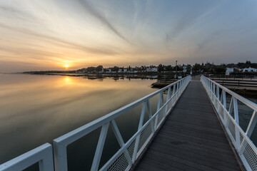 Fototapeta premium sunset over a footbridge at the seaside, seascape, landscape