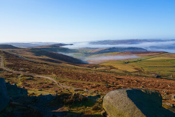 Fototapeta na wymiar Misty spring morning in Derbyshire from high on Stanage Edge.