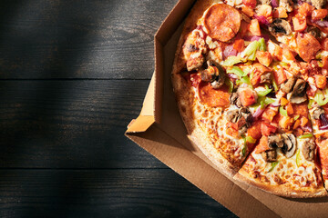 A box of pizza on a summer day. Pizza delivery concept. Top view. Flat lay.