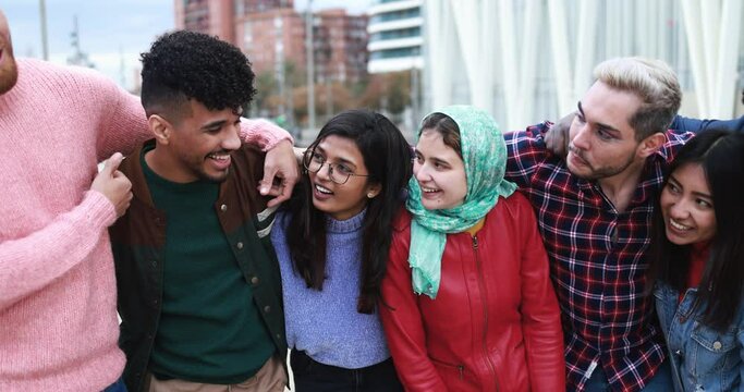 Young diverse people having fun outdoor laughing together - Diversity concept