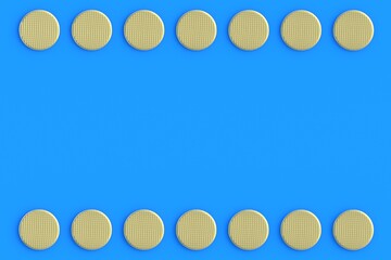 Frame of golden metal heads of nails on blue background. Building equipment. Luxury tool for repair, renovation. Expensive repairs. Top view. Copy space. 3d render