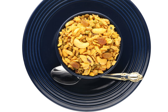 Indian Namkeen Snacks served in ceramic bowl & plate OR Indian traditional Namkeen Food Navratan Mixture or Navratna Mix Namkeen Also Know as Nimco, Namkin, Mixture or Nimko