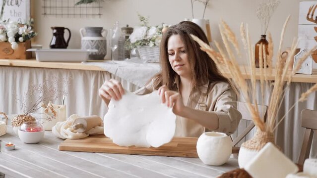 Handcraft woman master modeling cold porcelain, pressure dough porcelain clay, Girl sculpts from porcelain, hobby for the soul scandinavian and boho style interior decor