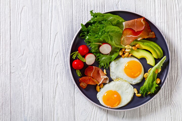 fried eggs, lettuce, avocado, radish, peanuts, ham