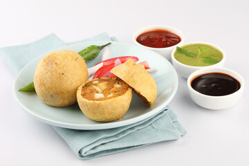 paneer bonda indian snack,Indian snack aloo vada or bonda made from potato with coconut chutney. indian snacks Aloo Bonda vada / pakoda / pakora. Served with green chutney.