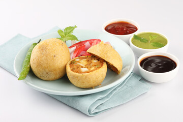 paneer bonda indian snack,Indian snack aloo vada or bonda made from potato with coconut chutney. indian snacks Aloo Bonda vada / pakoda / pakora. Served with green chutney.
