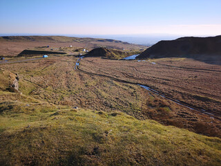 Beautiful shot of green landscape of the Clee Hills aria under blue clear sky - obrazy, fototapety, plakaty