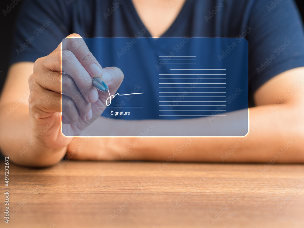 Poster man in casual using a pen signing electronic documents on digital documents on a virtual screen
