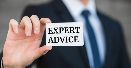 EXPERT ADVICE message on the card held by businessman , business concept