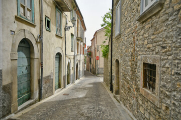 Small street between the old houses of Agnone, a medieval village in the mountains of Molise region