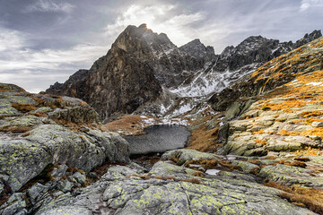 Sun shinning over peak Prostredny hrot in High Tatras mountains, Slovakia