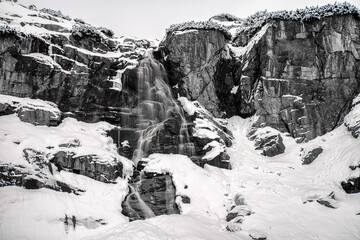 Long exposure shot of waterfall in mountains at winter. Black and white photography © Jaroslav Moravcik