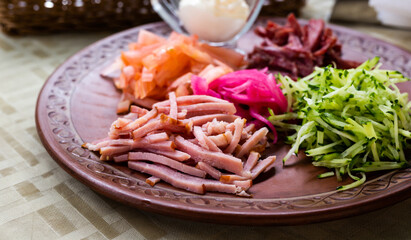 traditional Belarusian salad of vegetables and bacon. salad Paparats kvetka