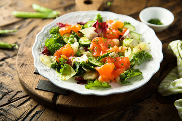 Healthy vegetable salad with smoked salmon