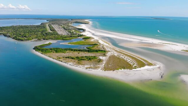 Aerial fly Fort De Soto Park. South Florida. Vast white strand known for its broad tidal pool, sand dollars.