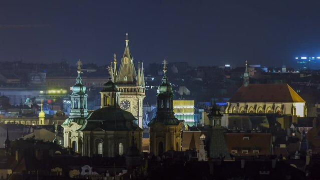 Prague night timelapse, fantastic old town roofs during twilight with towers and night illumination, Czech Republic