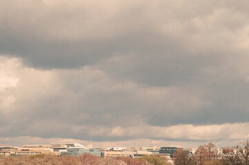 Obraz premium Rooftops of Washington DC under Blue Sky and White Clouds