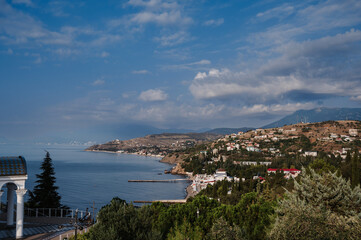 Panorama of the resort village in Crimea on the Black Sea coast in summer on a sunny day