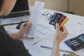 Financial owe, hand of asian woman sitting, holding many credit card, stressed  by calculate...