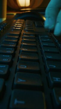 Close-up Macro Shot: Person Typing on the Computer Keyboard. Video Footage with Vertical Screen Orientation 9:16