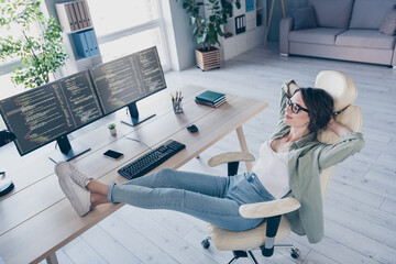 Full size portrait of happy lady sit chair hands behind head legs on desk drowse daylight...