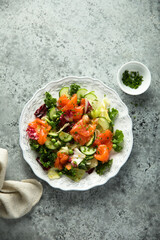 Healthy vegetable salad with smoked salmon