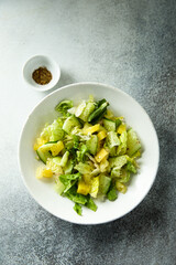 Leaf salad with cucumber and pineapple