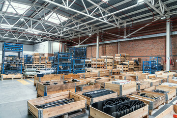 Distribution warehouse or logistic center with goods and cargos in boxes ready for shipment and delivery transportation.