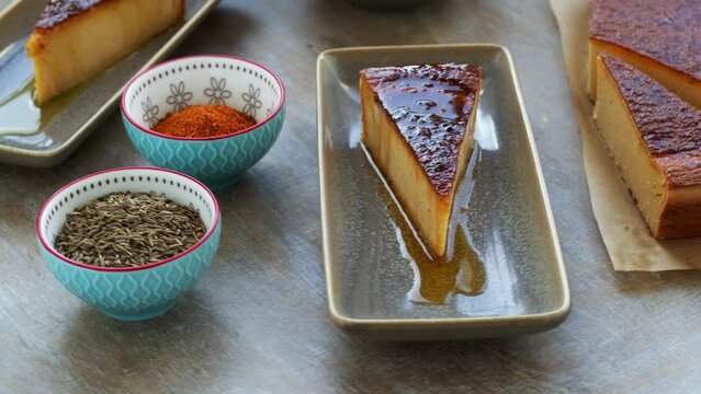 Chickpea flour kalinte dish with olive oil and spices with fresh vegetable salad. Moroccan cuisine, table spin.