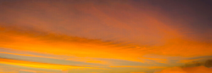 Panorama-The sky is a colorful orange-yellow horizontal line in the beautiful evening in the midst of a peaceful, warm and romantic nature in the countryside and very beautiful.