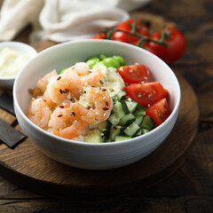 Homemade rice bowl with shrimps and vegetables
