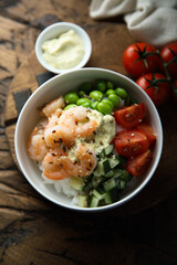 Homemade rice bowl with shrimps and vegetables
