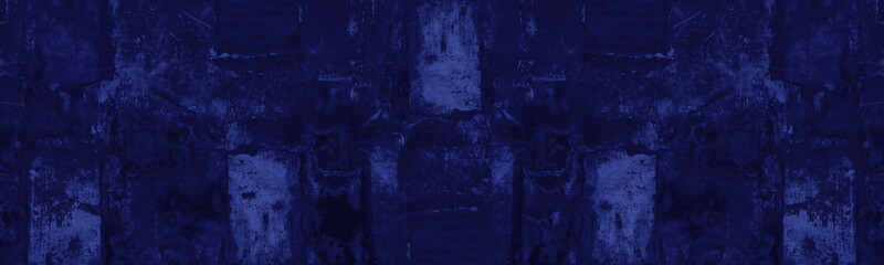 Navy blue old patched shabby concrete wall with peeling paint wide texture. Indigo colored wall....