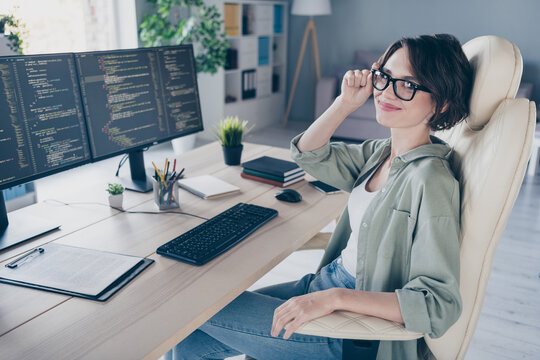 Portrait of positive pretty lady sitting chair arm touch eyeglasses look camera server optimization office inside