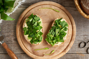 Wild garlic or ramson leaves on sourdough bread with butter