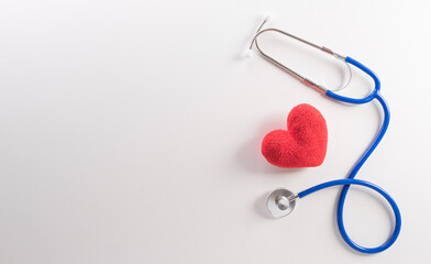 Top view of doctor stethoscope and red heart on white background. International nurse day and medical concept.
