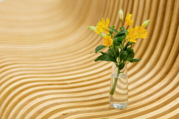 bouquet of flowers in a vase wooden background