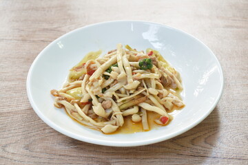spicy stir fried shimeji mushroom with chop pork and pepper on plate