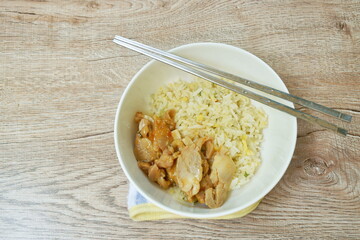 fried rice with egg topping chicken in Korean sauce on bowl