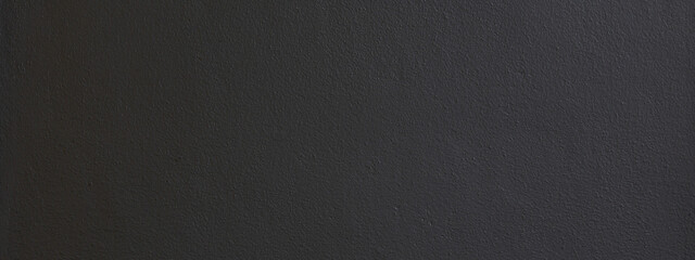 Black color with an old grunge wall concrete texture as a background. Wide banner