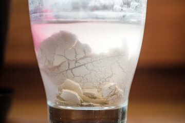 glass of water whit an egg inside
