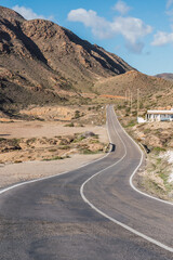 Desertic curvy road in Cabo de Gata National Park, Almeria, Spain.