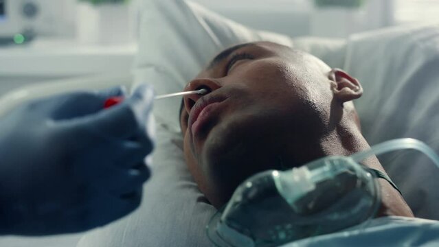 Nose swab for covid testing closeup. Unknown doctor hands taking medical sample.