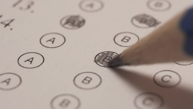 Changing Answer By Crossing It And Select Another One. Multiple Choice Examination. Close Up