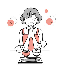 「いただきます」する年輩女性